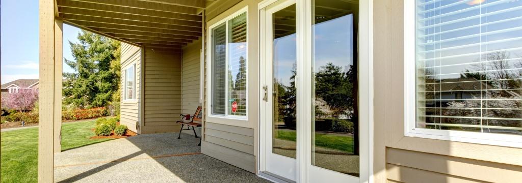 Backyard Walkout Deck with Concrete Floor. View of Slide Doors and Windows in Raleigh, NC