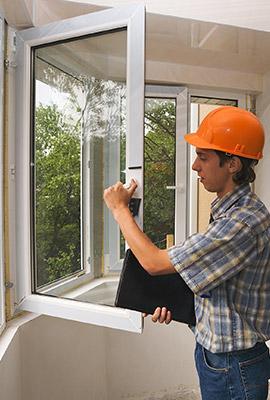 Man Installing Window Replacements in Home in Durham, NC 