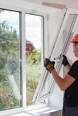 Worker Installing New Windows for Window Replacement in Raleigh