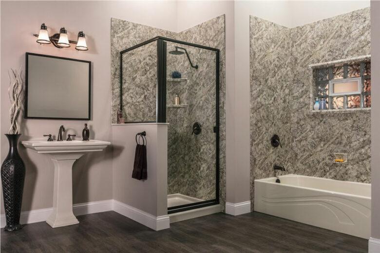 Walk-in shower in Raleigh home with black accents and separate tub