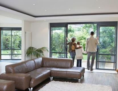 Family Looking Out Sliding Glass Doors in Cary, NC