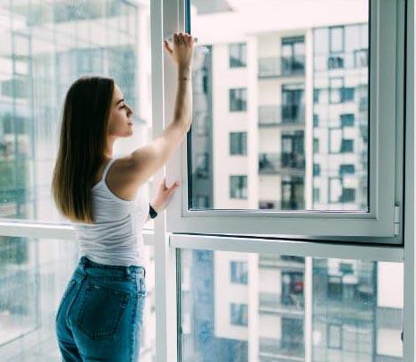 Woman Opening an Impact Window in Chapel Hill, NC